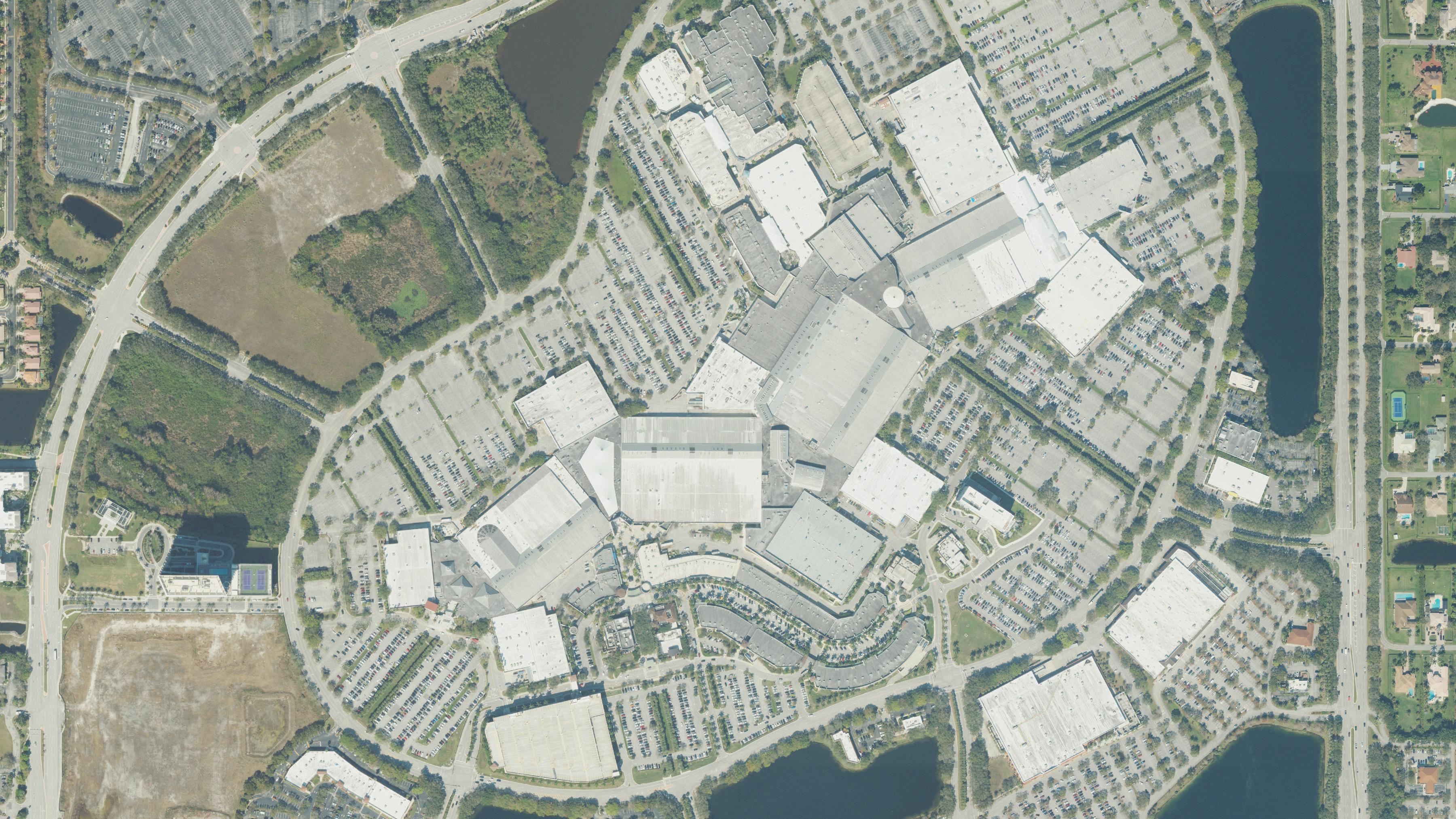 Aerial photograph of a large South Florida shopping center and its parking fields